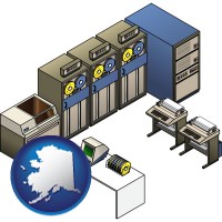 ak map icon and a 20th century mainframe computer used for data processing